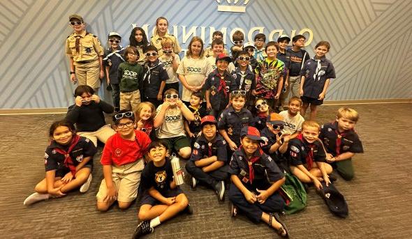 A group of cub scouts pose for a photo. 