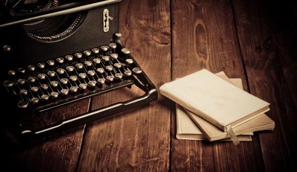 Photo of a typewriter on a desk.