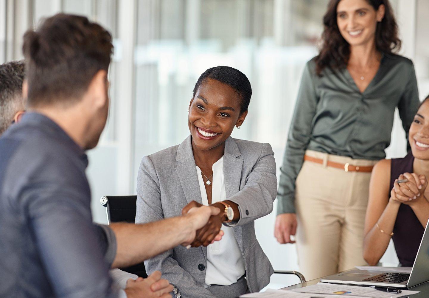 Business woman shaking hands